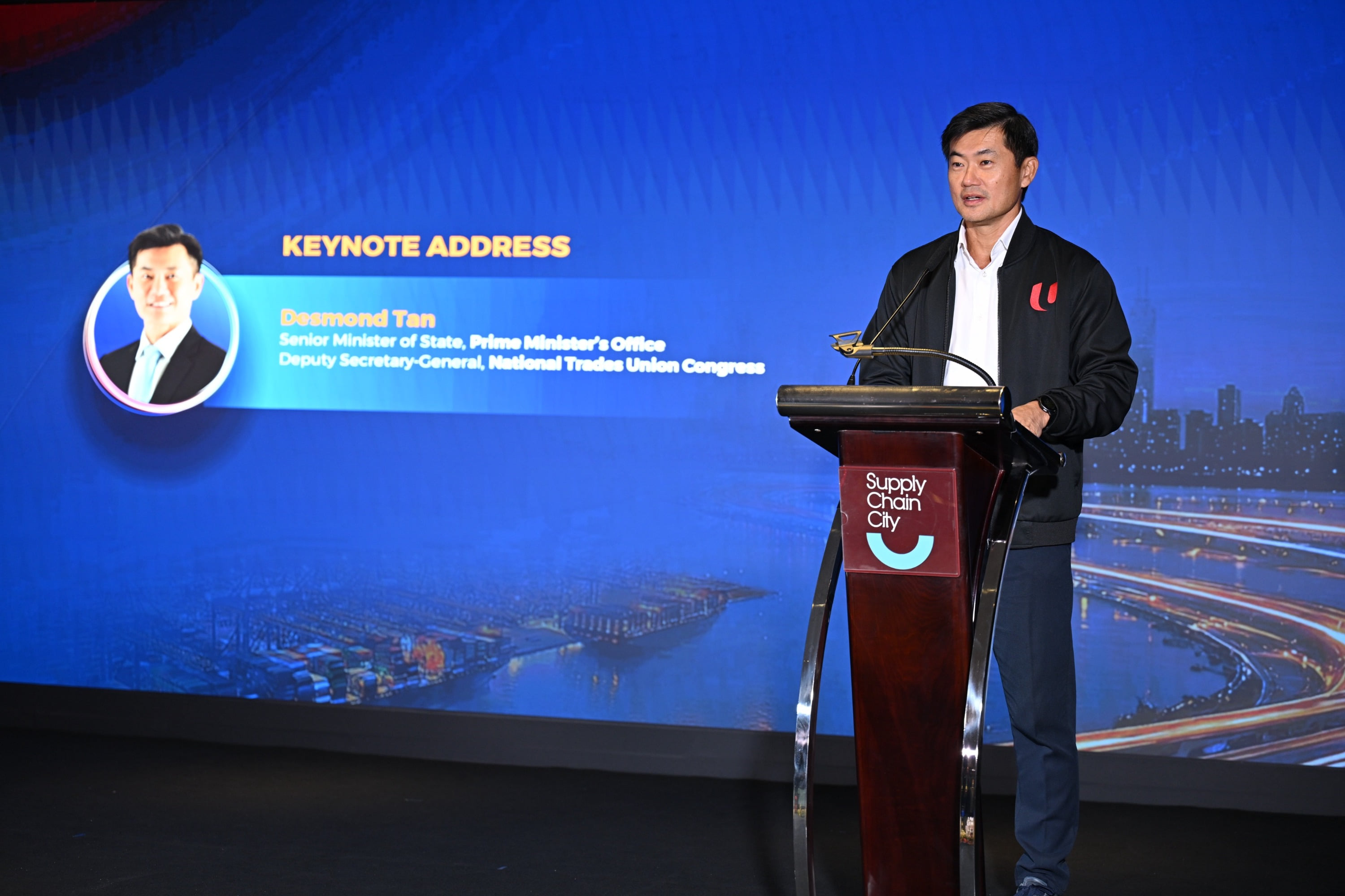 SMS Desmond Tan giving his keynote address.